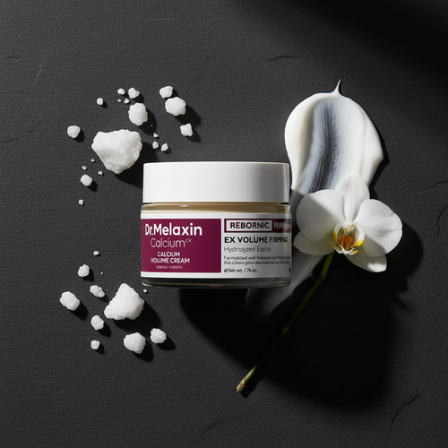 Luxury flat lay - Dr.Melaxin eye cream with orchid and crystals